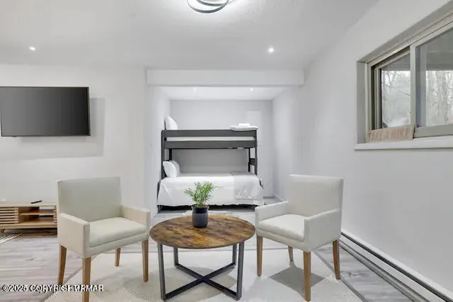 a living room with furniture and a flat screen tv