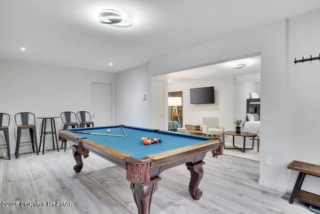 a room with furniture and wooden floor