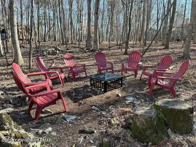 a view of a chairs with sitting area