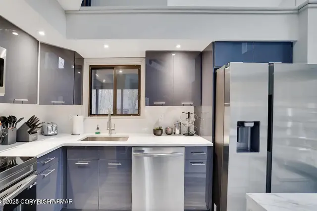 a bathroom with a sink double vanity and a mirror