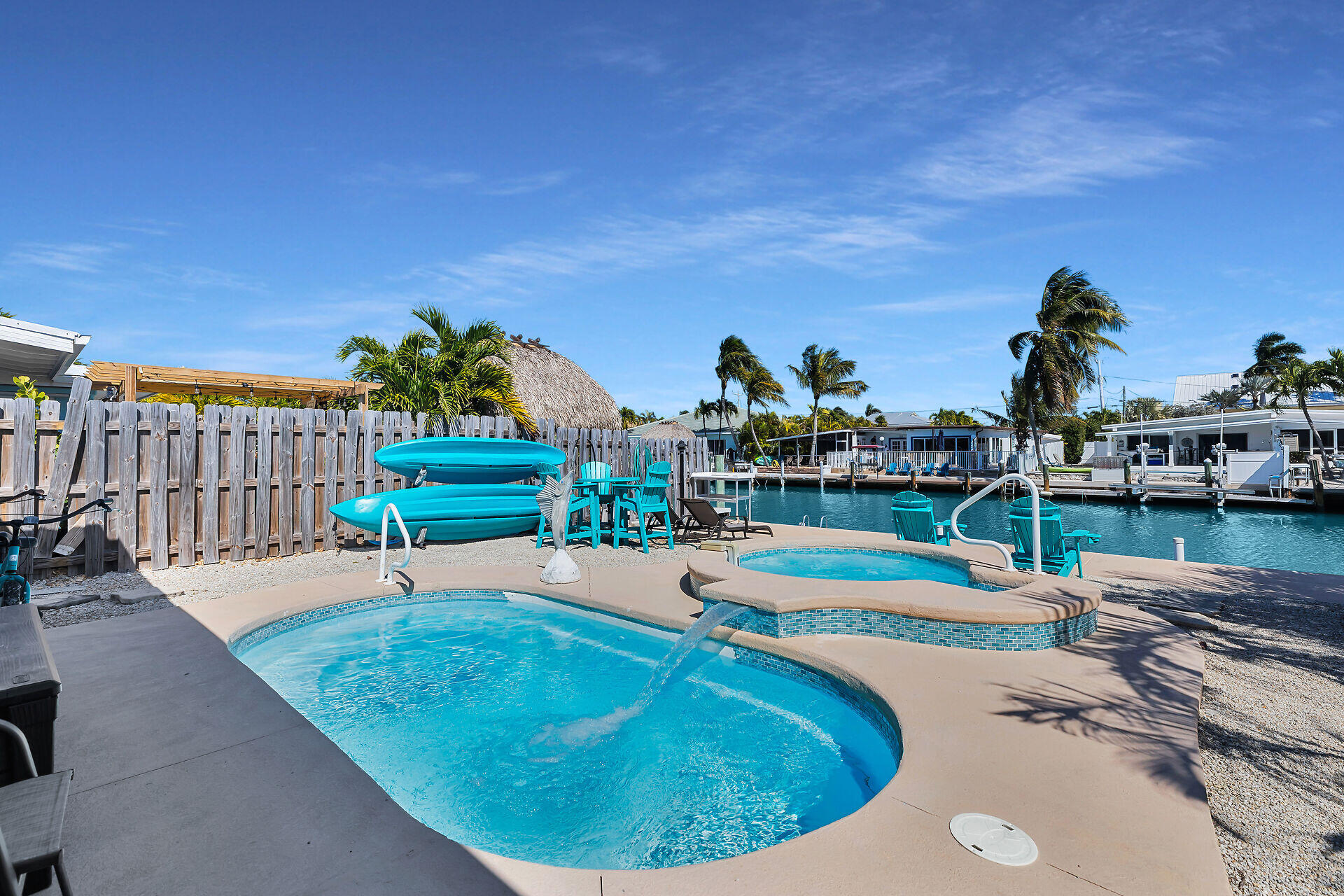 230 11th Street Key Colony Beach, FL 33051 - Photo 11 of 44 a view of a swimming pool with a patio