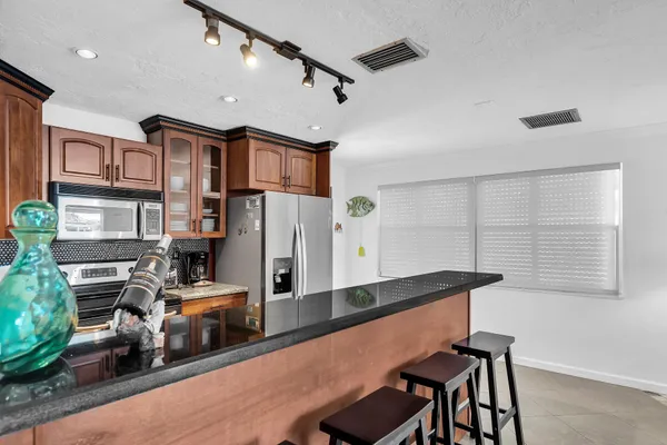 a bedroom with a bed and couch