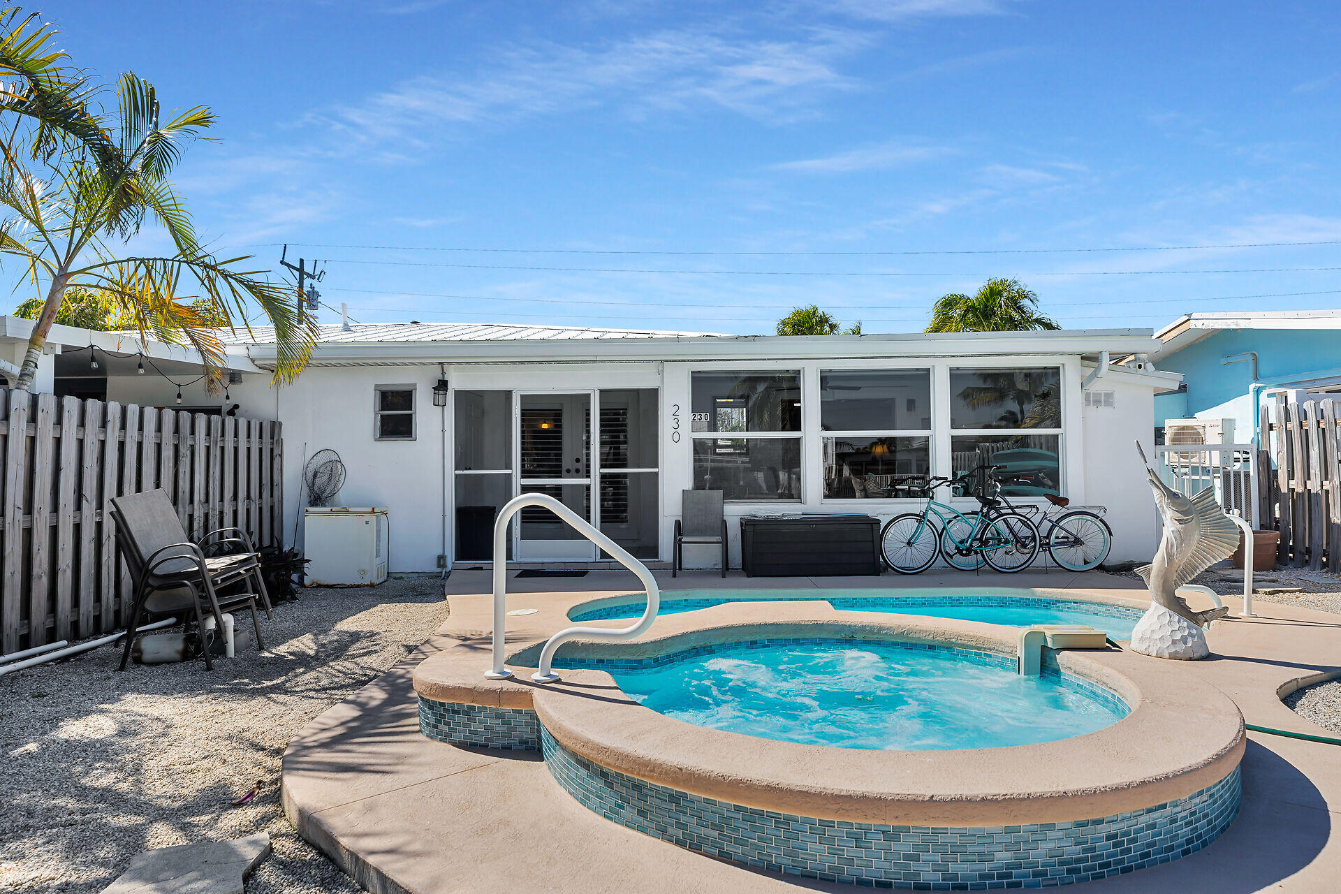 230 11th Street Key Colony Beach, FL 33051 - Photo 6 of 44 a view of a house with backyard and sitting area