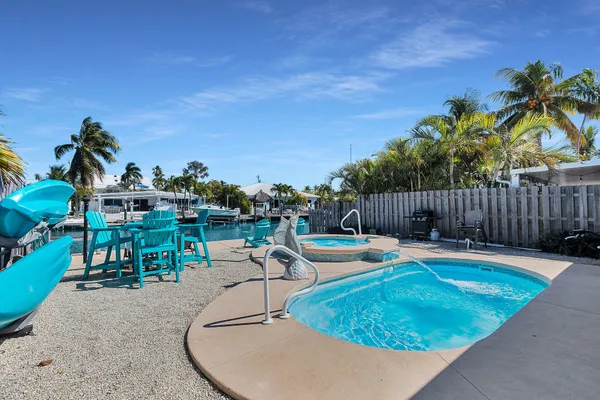 a view of a swimming pool with a patio