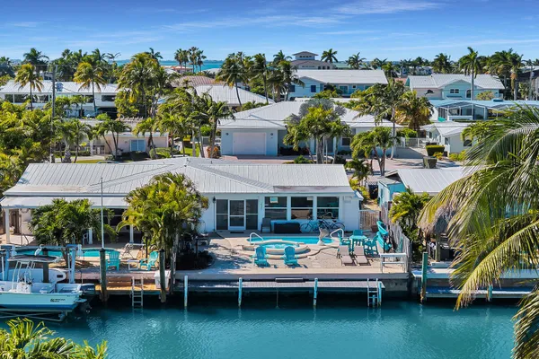 a view of a house with outdoor space and lake view
