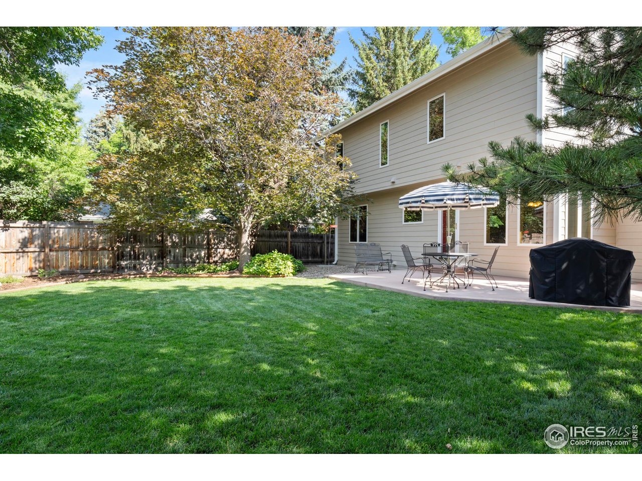 The home sits on a generous 9,415 square foot lot with beautifully landscaped front and back yards.