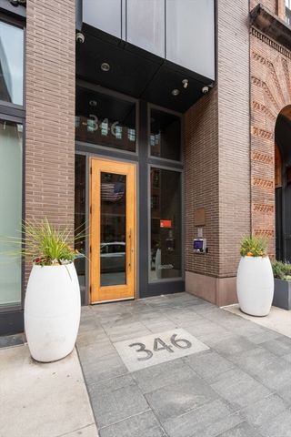 a view of a door and chair in the patio