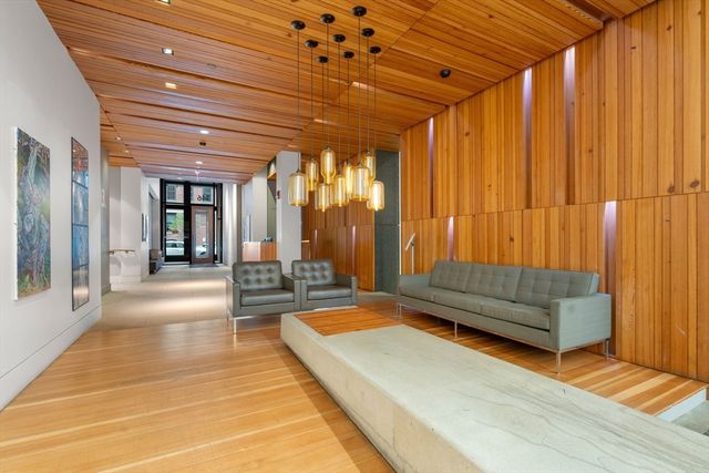 a living room with furniture and a rug