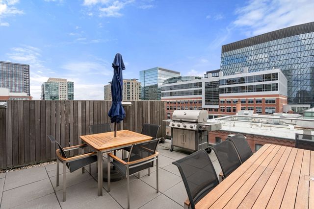 a view of a chairs and table in the balcony