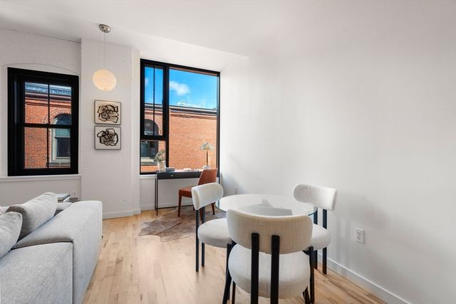 a living room with furniture and window