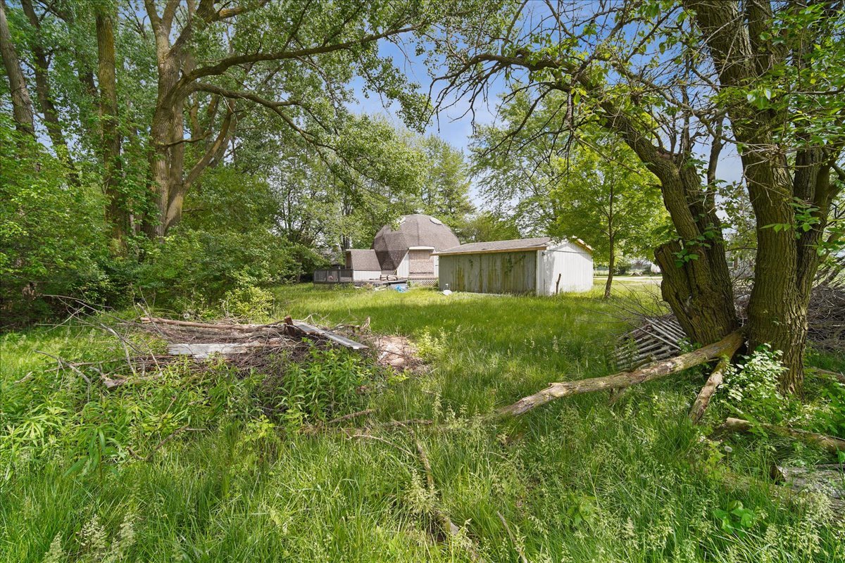 17318 Air Strip Road Hudson, IL 61748 - Photo 2 of 11 a house view with a outdoor space