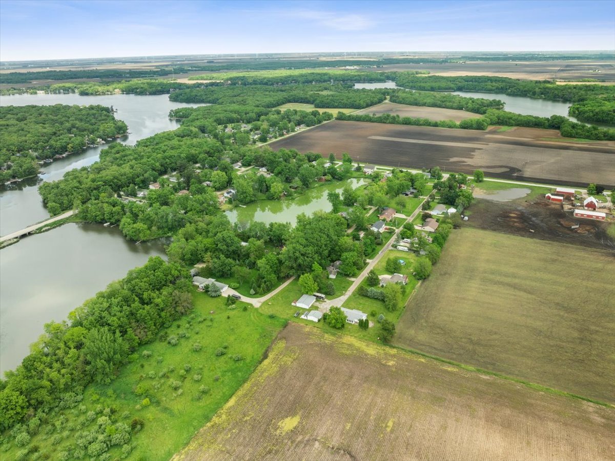 17318 Air Strip Road Hudson, IL 61748 - Photo 5 of 11 a view of a lake with a yard