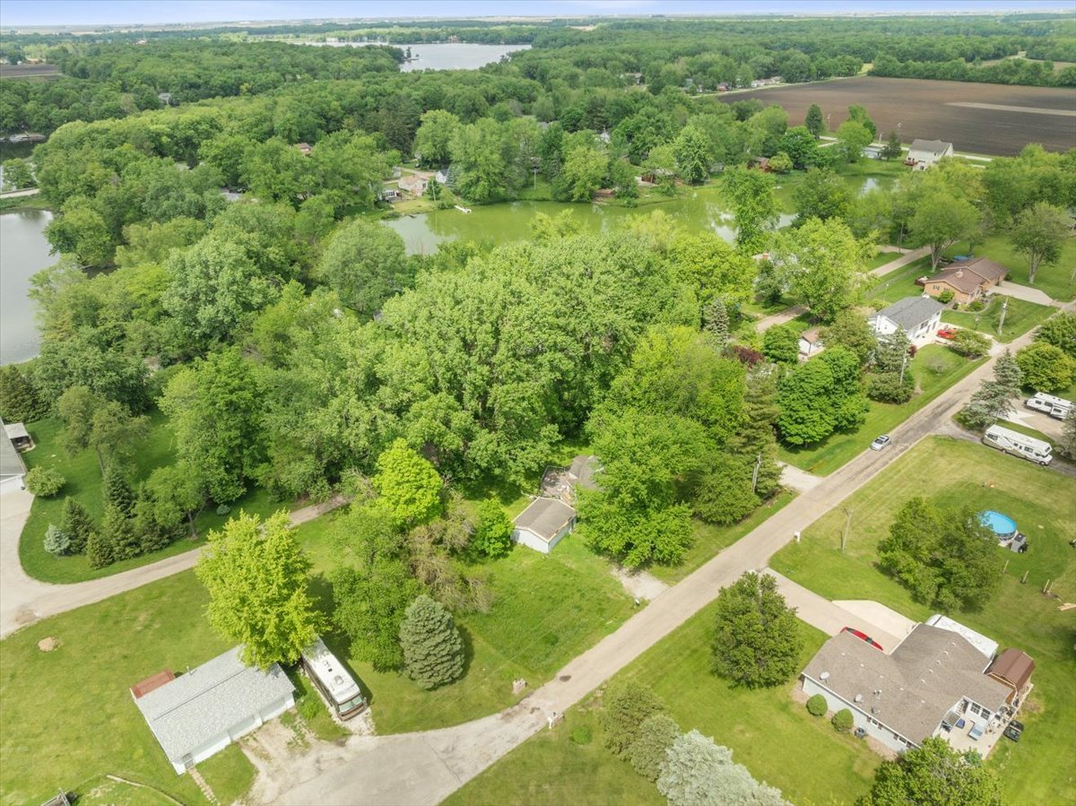 17318 Air Strip Road Hudson, IL 61748 - Photo 9 of 11 a view of a garden with a lake