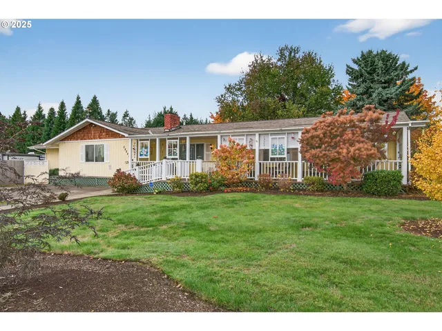 a view of a house with yard and a garden
