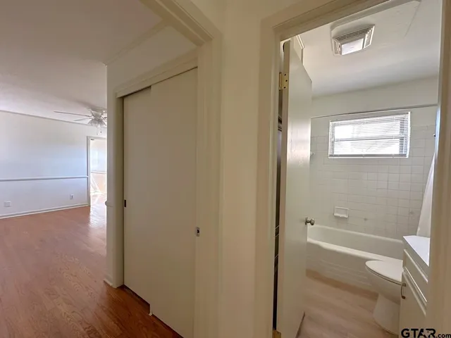 a bathroom with a bathtub and shower