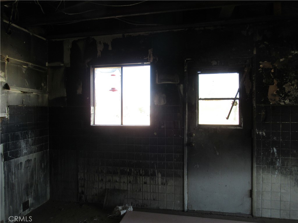 64654 Sun Mesa Road Joshua Tree, CA 92252 - Photo 14 of 25 a bathroom with a glass shower door