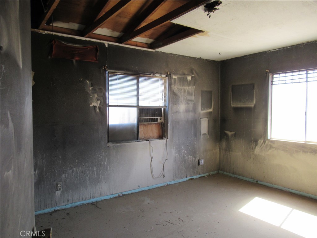 64654 Sun Mesa Road Joshua Tree, CA 92252 - Photo 16 of 25 a view of an empty room with a window