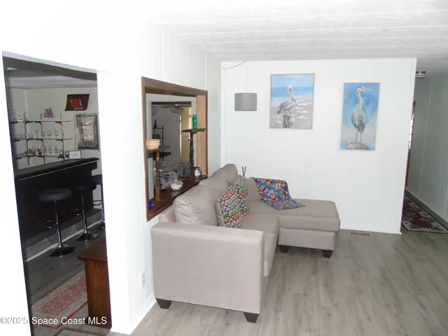 a kitchen with a refrigerator and a sink