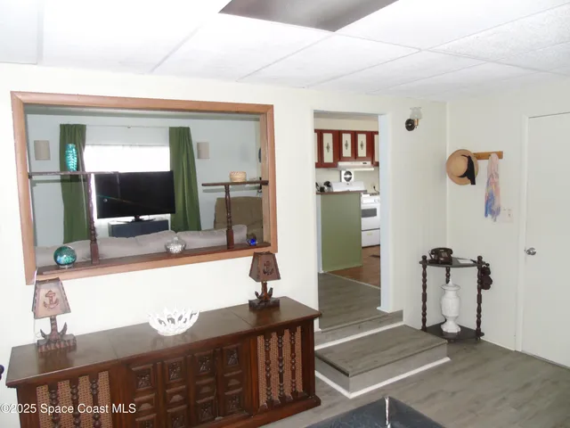 a view of hallway with livingroom