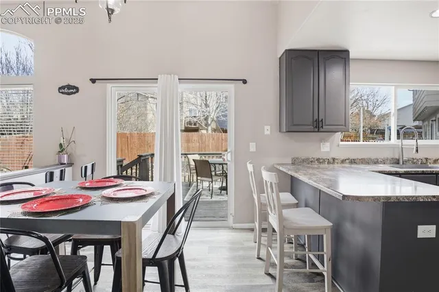 a view of a dining room with furniture and window