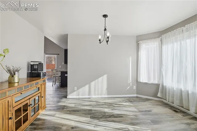 a view of a kitchen with furniture and staircase