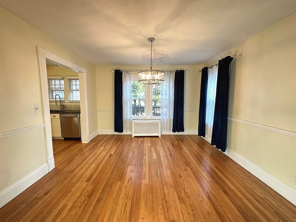 132 Maple Road Longmeadow, MA 01106 - Photo 7 of 29 wooden floor in an empty room with a window