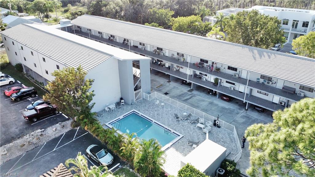 Aerial view of apartment complex and a pool