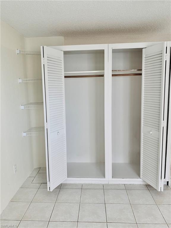 826 Wiggins Pass Road, Unit 214 Naples, FL 34110 - Photo 14 of 21 View of closet