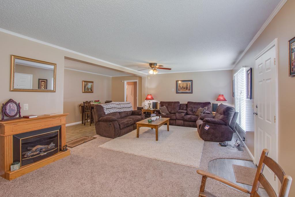 4035 Rock Springs Road Watertown, TN 37184 - Photo 4 of 26 a living room with furniture a fireplace and a window