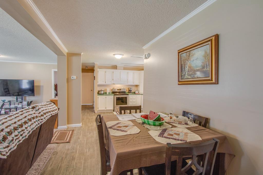 4035 Rock Springs Road Watertown, TN 37184 - Photo 8 of 26 a view of a dining room with furniture and wooden floor