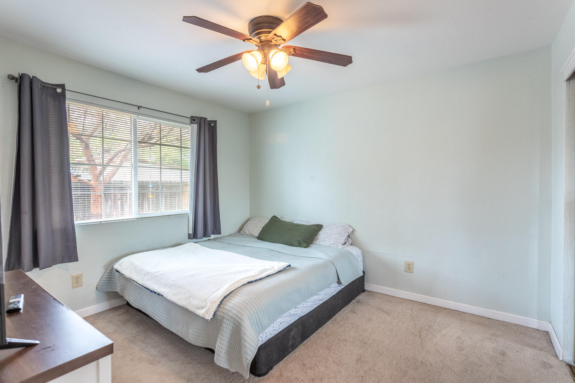 910 Aloha Street Red Bluff, CA 96080 - Photo 11 of 26 a bedroom with a bed and a window