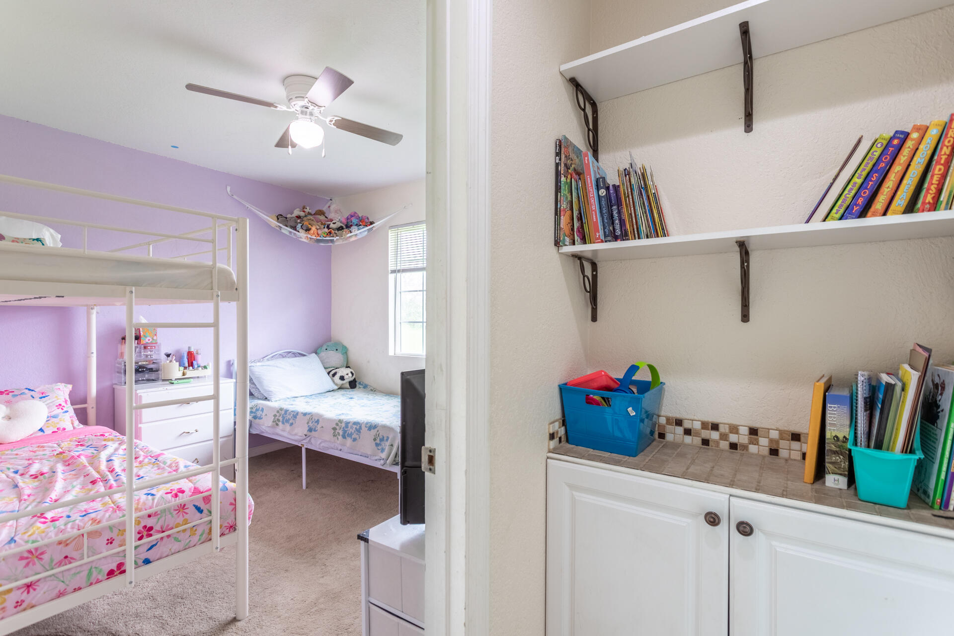 910 Aloha Street Red Bluff, CA 96080 - Photo 16 of 26 a bedroom with bed and a book shelf