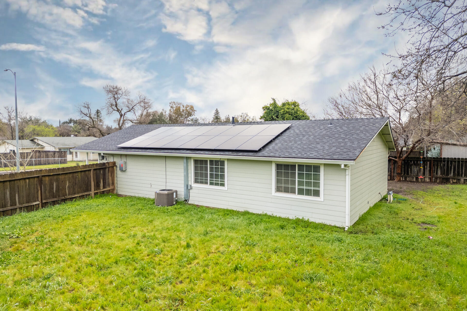 910 Aloha Street Red Bluff, CA 96080 - Photo 23 of 26 a view of a house with a yard and sitting area