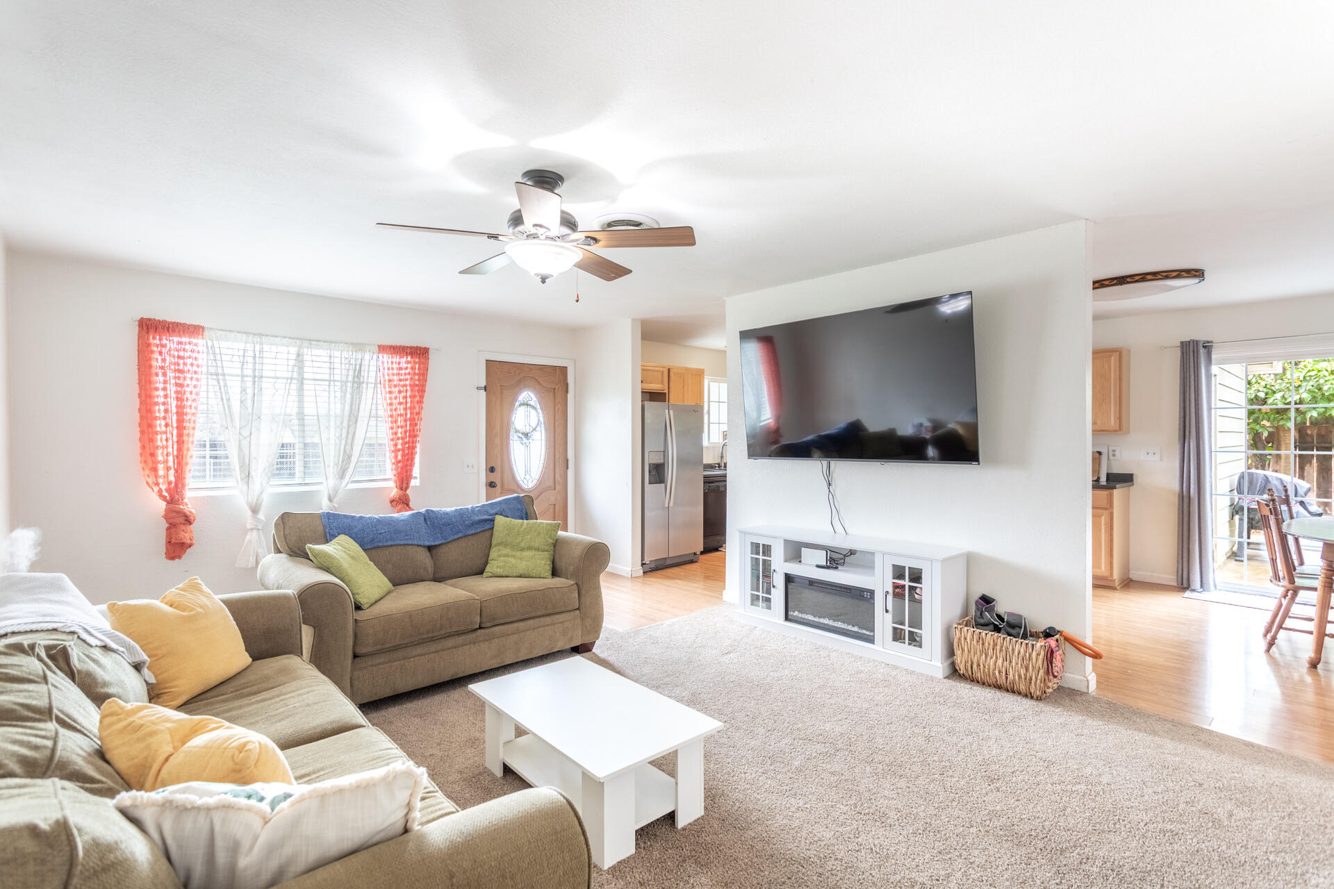 910 Aloha Street Red Bluff, CA 96080 - Photo 3 of 26 a living room with furniture and a flat screen tv