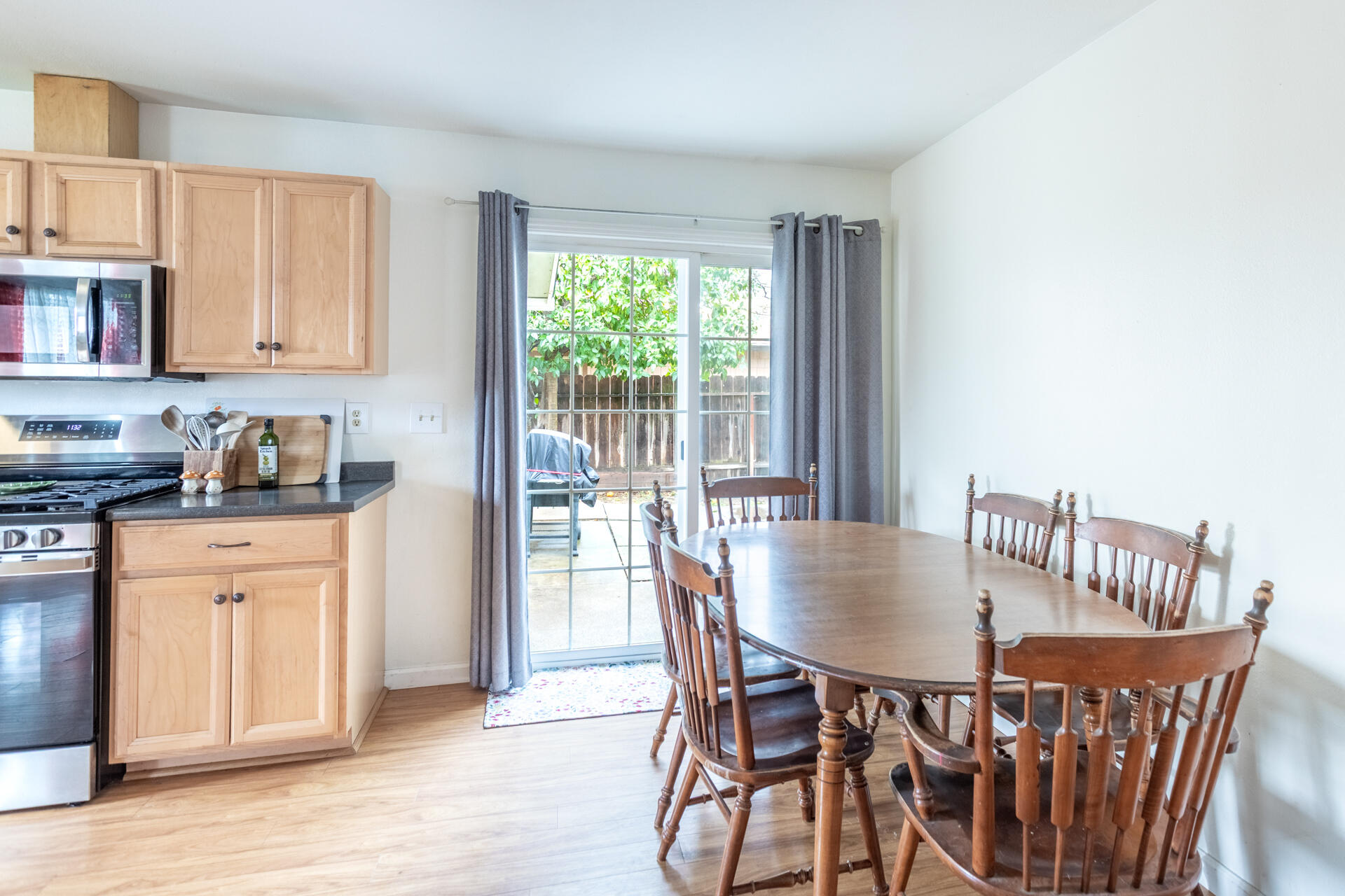 910 Aloha Street Red Bluff, CA 96080 - Photo 8 of 26 a view of a dining room with furniture and wooden floor