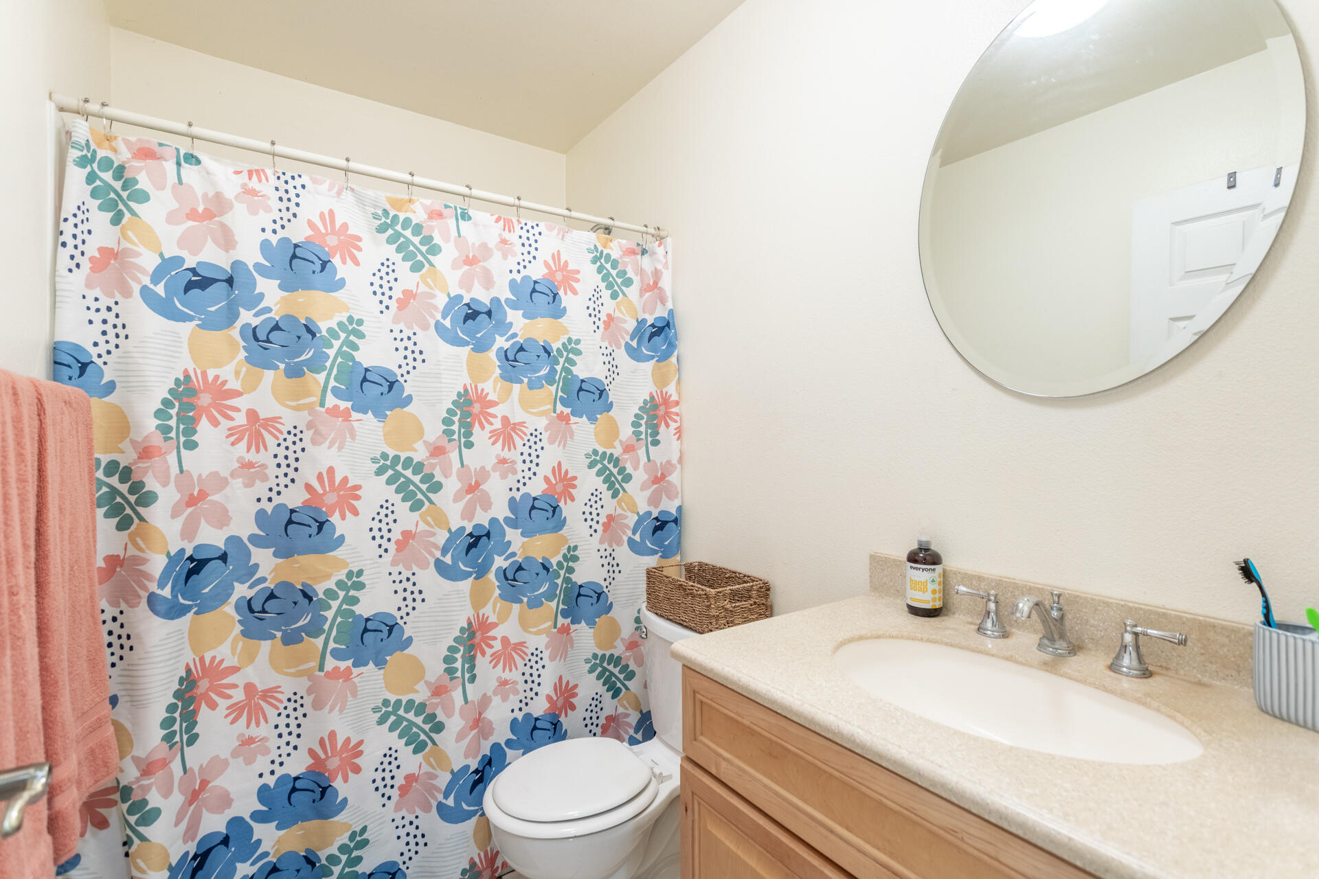 910 Aloha Street Red Bluff, CA 96080 - Photo 9 of 26 a bathroom with a sink a toilet and a mirror