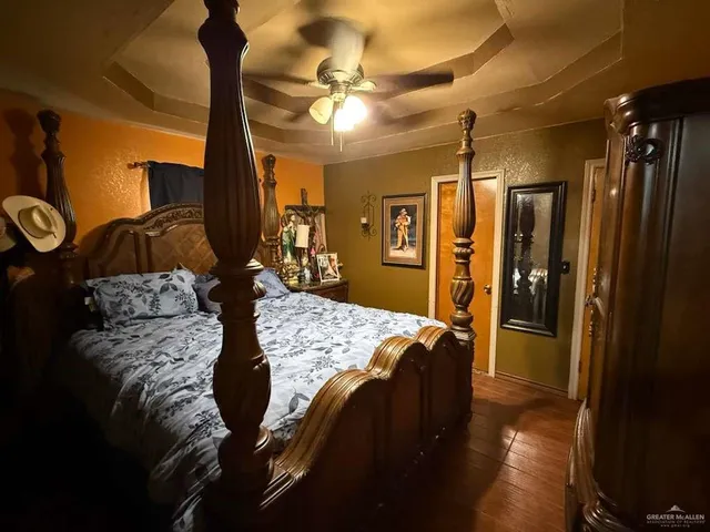 a bed sitting in a room next to a window