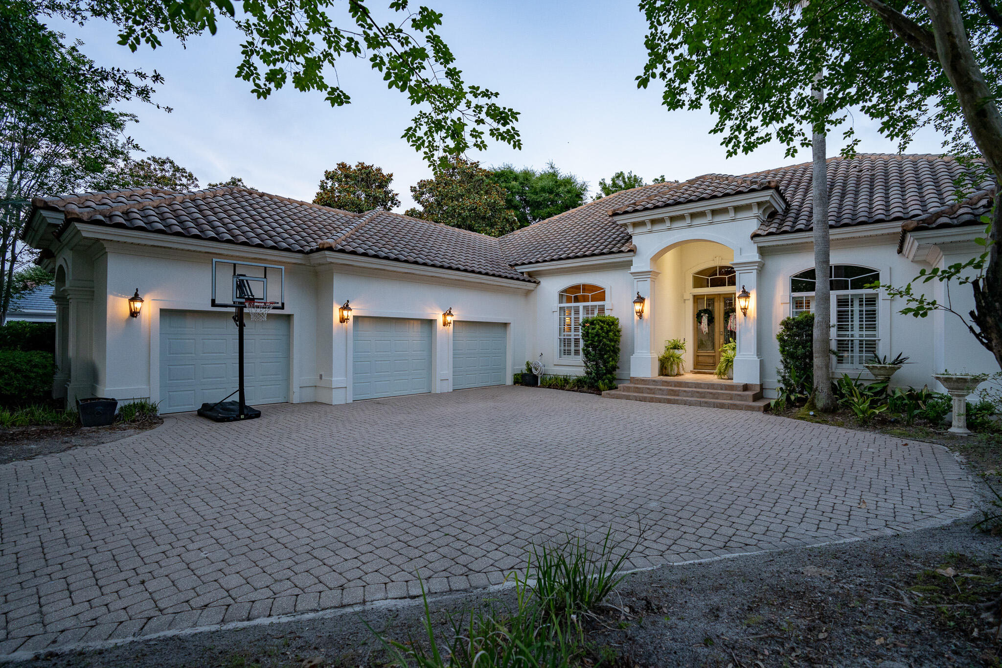 4372 Stonebridge Road Destin, FL 32541 - Photo 4 of 83 a front view of a house with a yard and garage