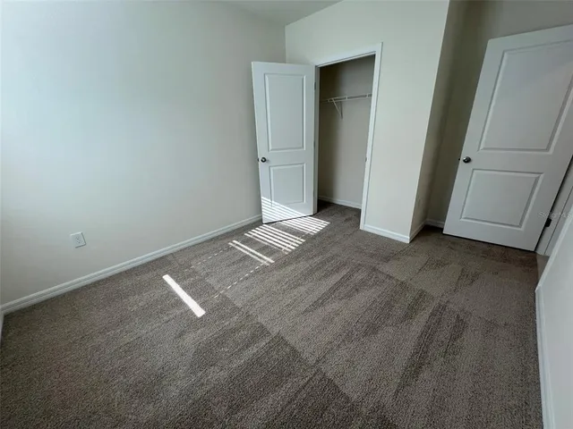 a view of house with backyard