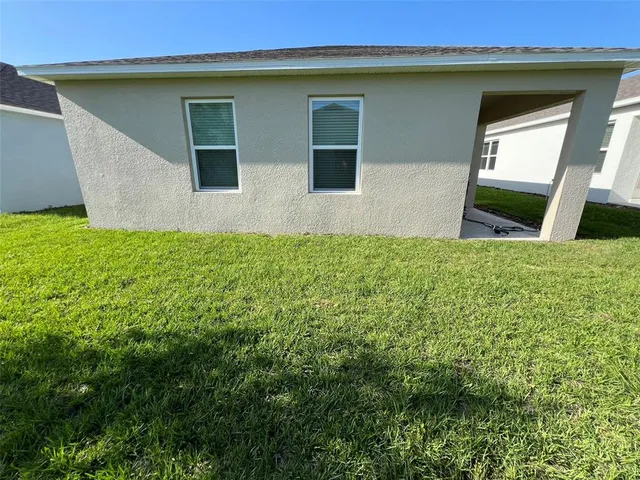 a view of front of house with a yard