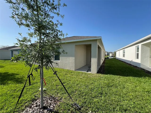 a house view with a backyard space
