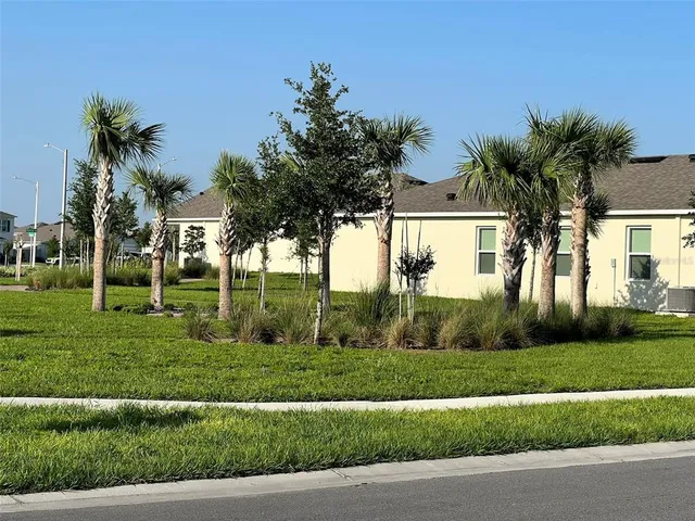 a view of a golf course with street