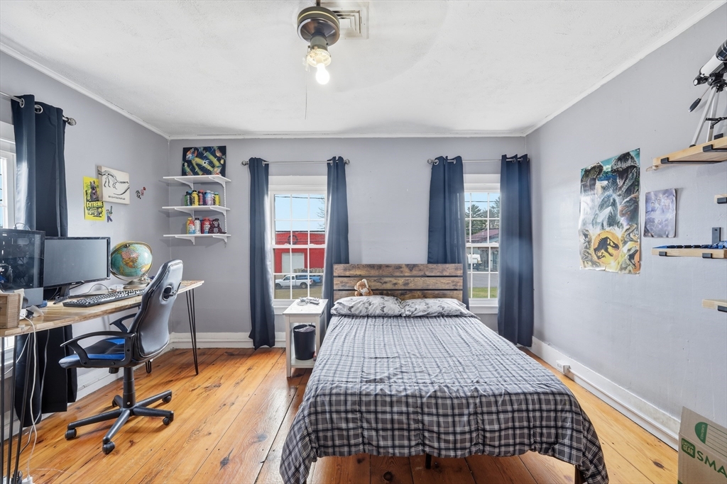 79 State Road Whately, MA 01373 - Photo 23 of 40 a bedroom with a bed and wooden floor