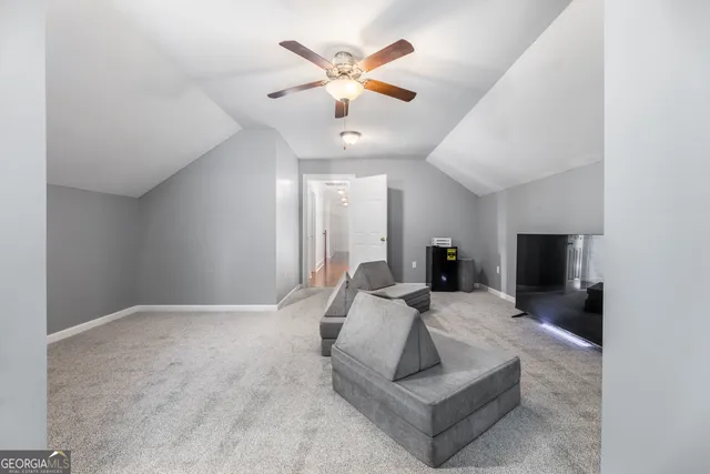 a bedroom with a bed a lamp and a chandelier