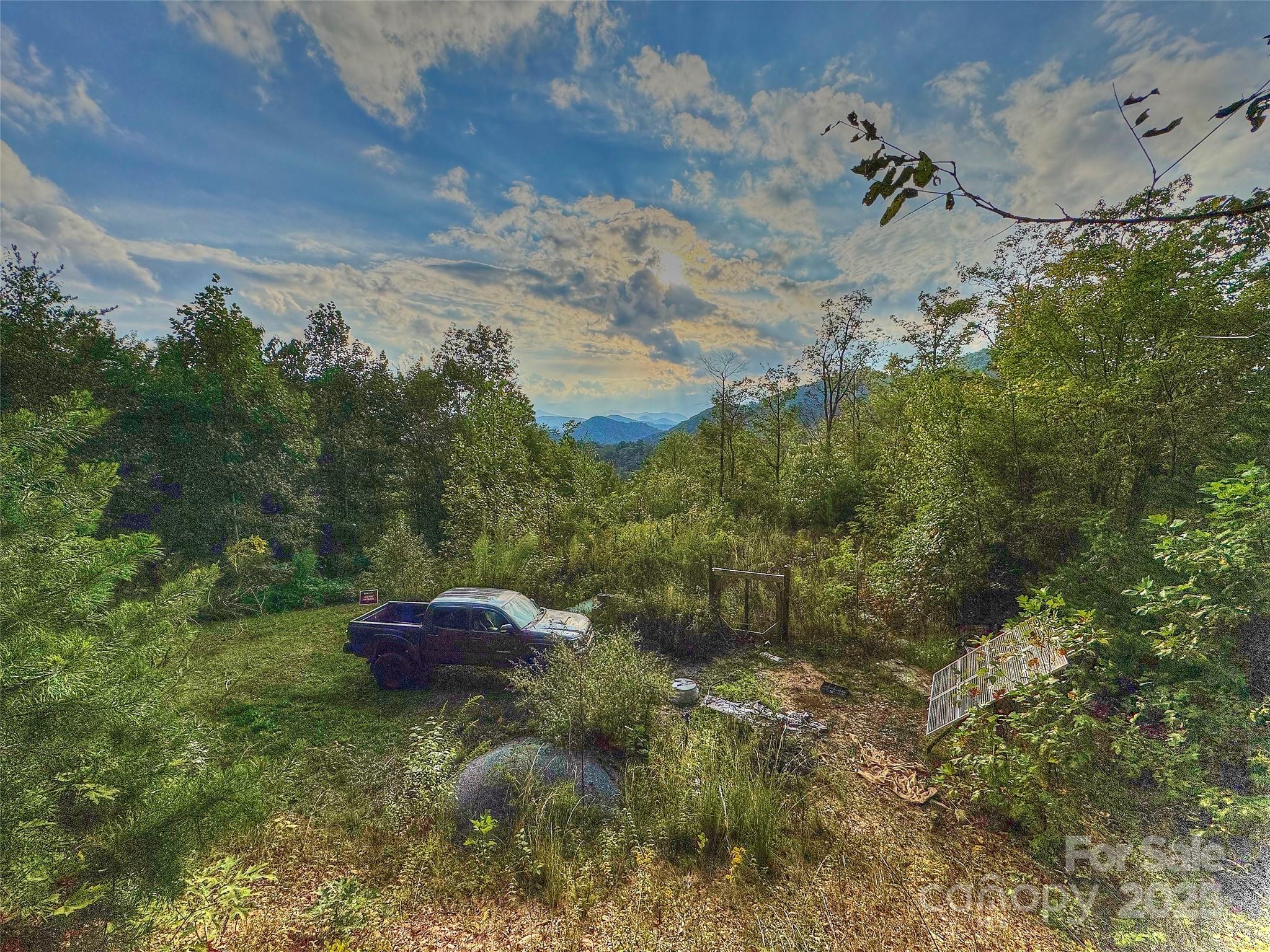 846 Legacy Lane Robbinsville, NC 28771 - Photo 2 of 7 a backyard of a house with table and chairs