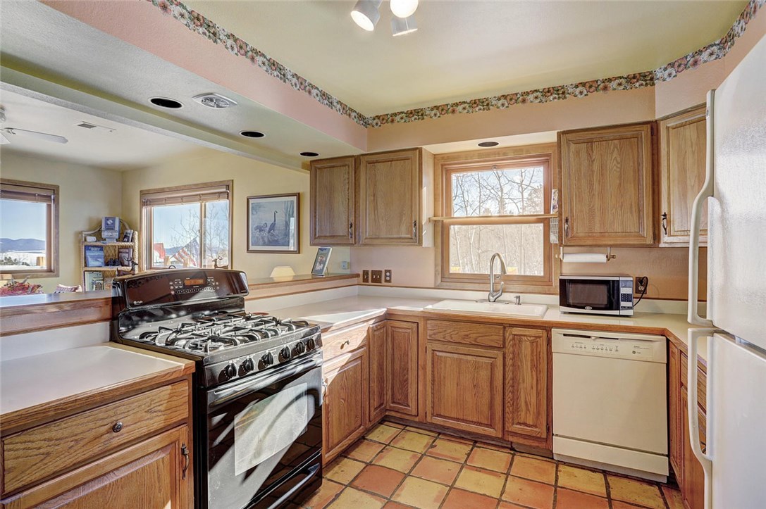 4283 Buffalo Ridge Road Como, CO 80432 - Photo 9 of 35 Gas stove top with plenty of counter space for all of your cooking needs.