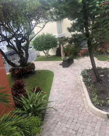 a view of a garden with a bench