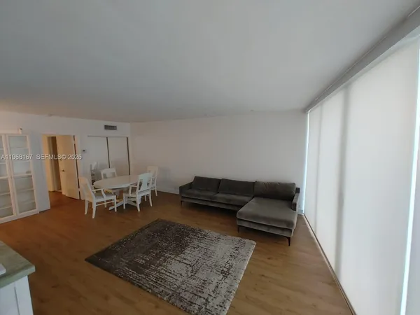 a living room with furniture and a rug