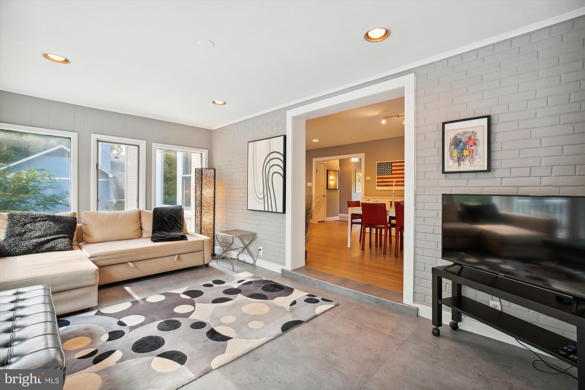 7304 Radnor Road Bethesda, MD 20817 - Photo 16 of 55 a living room with furniture and a flat screen tv