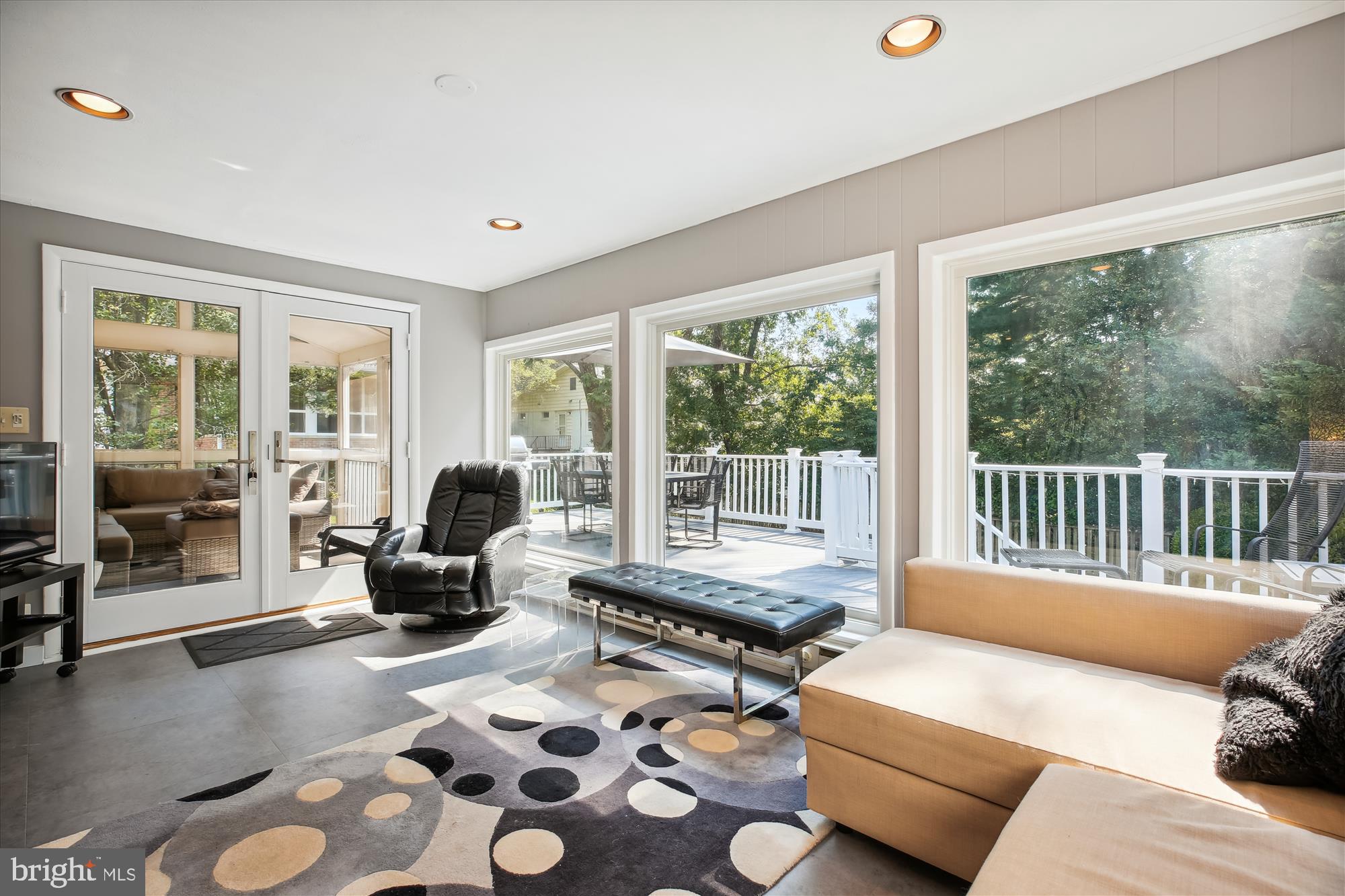 7304 Radnor Road Bethesda, MD 20817 - Photo 18 of 55 a living room with furniture and floor to ceiling windows